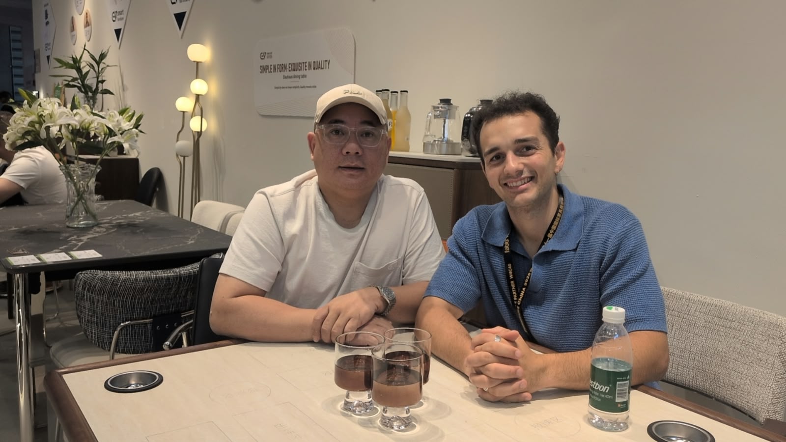 Two teammates sitting together at a table